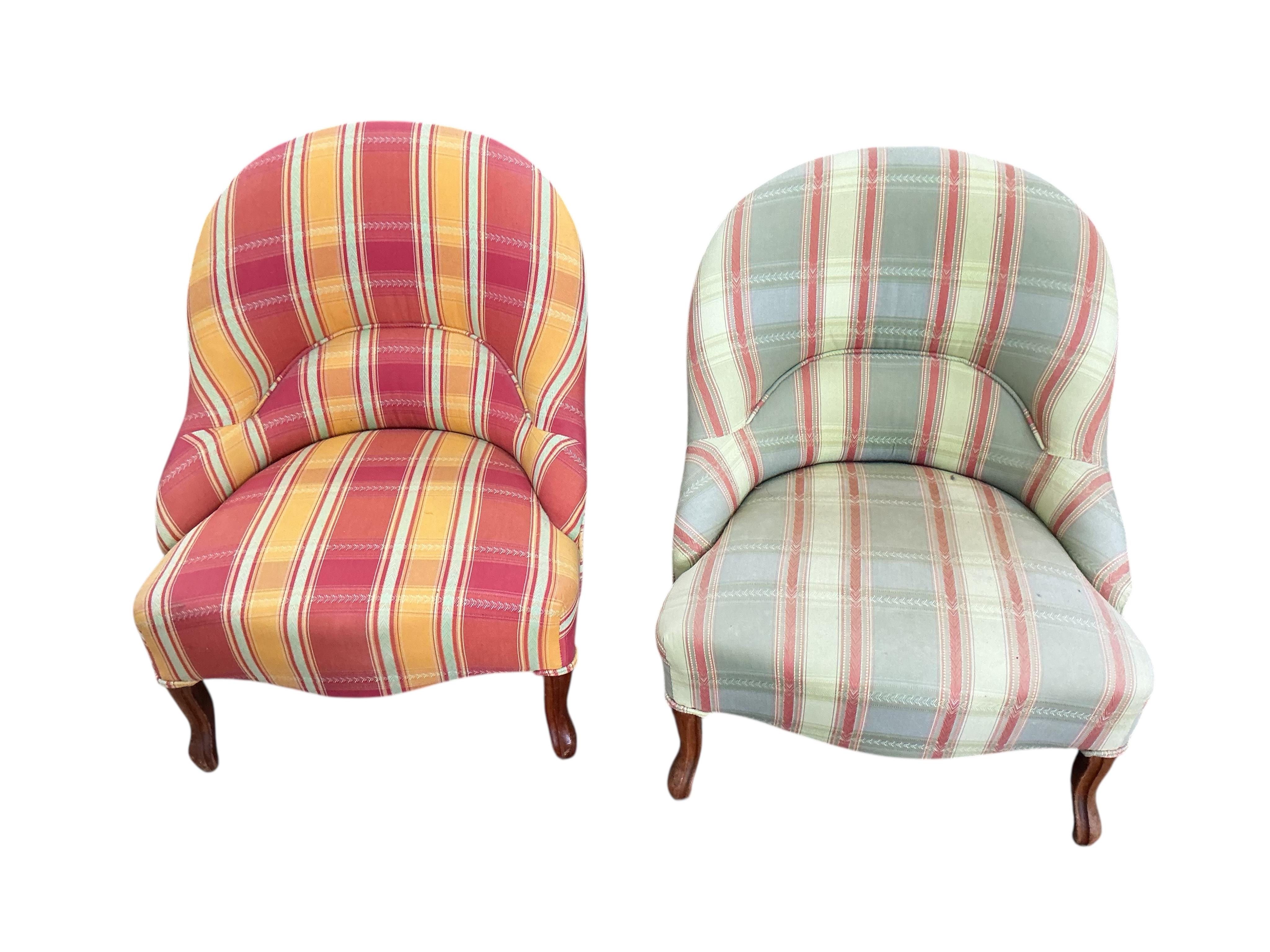 A pair of late 19th century upholstered mahogany nursing chairs, width 58cm, depth 50cm, height 70cm